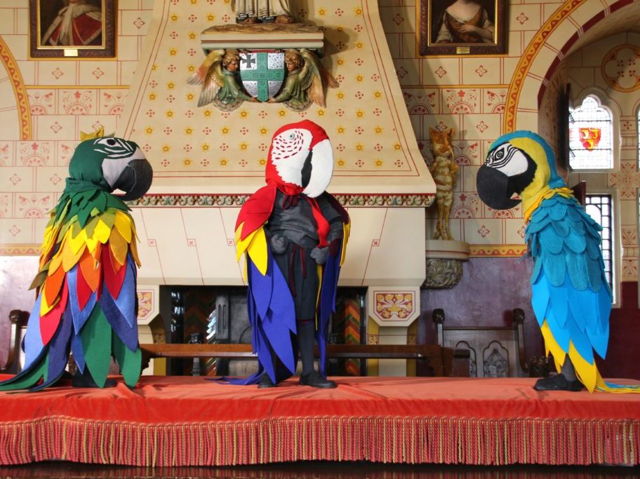 Three sculptures of parrot headed characters by Laura Ford in Castell Coch